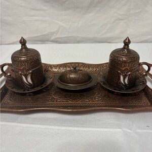 Vintage Turkish coffee set made of a copper alloy with porcelain cups.